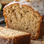 slice of freshly baked, golden-brown applesauce bread