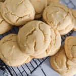 Chipless cookie recipe shown with freshly baked cookies cooling on a wire rack, featuring golden brown, crackly tops