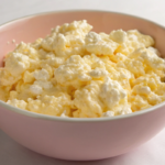 scrambled eggs with cottage cheese in a bowl