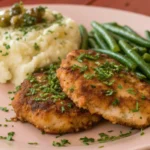 steakette recipe with potato pure and green beans on a plate