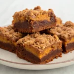 Pumpkin Brownies with crumble surface on a plate