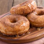 Apple Cider Donuts recipe on plate with cinnamon and sugar