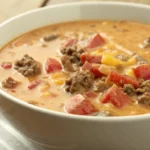 Crockpot Cheeseburger Soup slow cook with ground beef on a bowl
