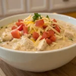 white chicken chili with cheese creamy in a bowl
