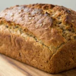 Ezekiel bread recipe showing a rustic multigrain loaf made with wholesome ingredients, inspired by multi grain bread recipes, wholemeal bread recipe styles, and hearty homemade baking.