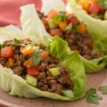 Ground beef lettuce wraps filled with seasoned beef and fresh toppings, served in crisp lettuce leaves for a light and flavorful meal.