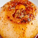 Onion boil recipe with tender whole onions cooked until soft and seasoned served as an easy comforting family meal.