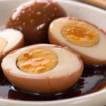 Soy sauce eggs marinated until glossy and flavorful shown as soy marinated hard boiled eggs inspired by mayak eggs recipe