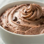 Cottage cheese chocolate mousse blended until smooth and creamy served as a healthy cottage cheese dessert in a small bowl.