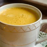 golden milk recipe golden milk in a cup on a table