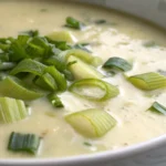 Potato leek soup served hot and creamy in a bowl with visible leeks and potatoes for a comforting homemade soup.