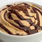 Cottage Cheese Peanut Butter Mousse served in a small bowl, smooth and creamy high protein dessert made from blended cottage cheese and peanut butter.