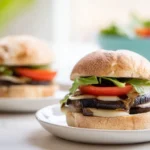 Grilled Portobello Mushroom Burgers on toasted buns with fresh arugula and caramelized balsamic glaze