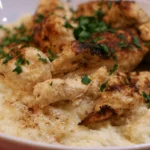Chicken mashed potato bowl with tender chicken pieces, creamy mashed potatoes, and rich gravy in a white bowl