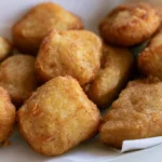 Burger King new chicken nuggets recipe golden crispy nuggets on white plate with dipping sauce