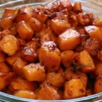 Honey Roasted Sweet Potatoes with caramelized golden edges served on a white platter