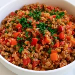 Unstuffed Peppers Recipe served in a large skillet with melted cheese and fresh parsley on top