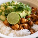 Honey Lime Chicken & Avocado Rice Bowl with caramelized chicken slices, creamy avocado, and fluffy rice garnished with cilantro