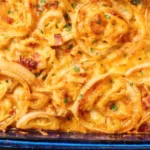 Tennessee onions recipe close-up showing bubbly cheddar cheese and caramelized onion rings from overhead angle