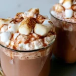 Toasted marshmallow syrup in a glass jar with golden brown color and smooth texture
